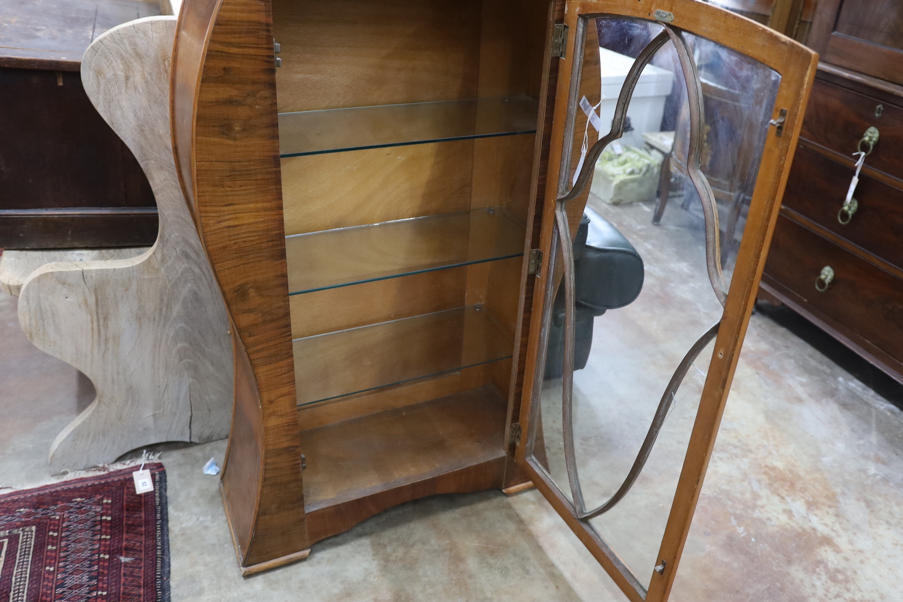 An Art Deco style walnut display cabinet, width 70cm, depth 26cm, height 119cm